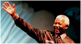 Nelson Mandela addressing the 1999 Parliament in Cape Town, South Africa – Photo: Parliament of the World’s Religions