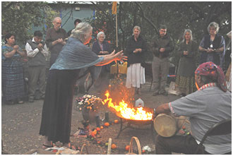 A fire ceremony led by Tata Apolinario, a Mayan shaman, on the right. – Photo: Greg Harder