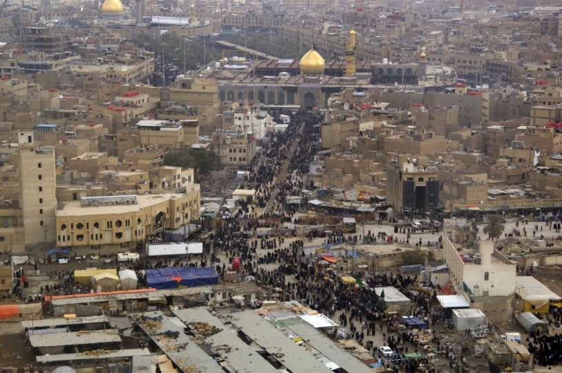 Millions work their way towards the Imam Husayn Shrine in Karbala . – Wikimedia, Denny Cantrell