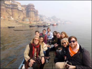 Professor Eck (l.) with students boating on the Ganges River at Varanasi during the Makar Sankranti festival – Photo: South Asian Institute at Harvard