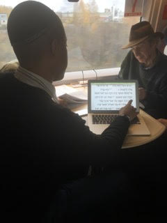 Yom Kippur prayers being read on Slavyanka’s train ride to St. Petersburg. – Photo: Bettina Gray