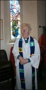 Rev. Marcus Braybrooke in clerical robes.