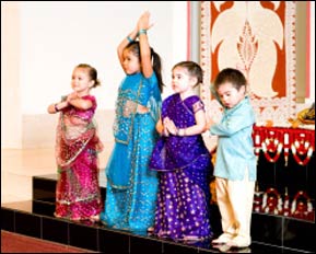 In our wedding, two nieces and a nephew in their traditional Indian outfits ready for an evening of raas & garba (traditional Gujarati folk dancing), honoring my ethnic background.