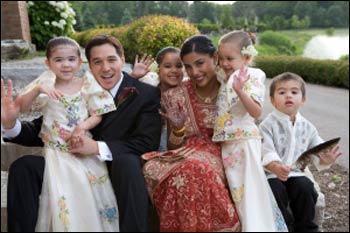 The same kiddos don traditional Filipino formal wear (butterfly dresses and the Barong Tagalog) honoring Robbie's ethnic background.