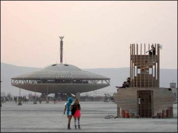 Burning Man stands high above the ‘flying saucer,’ all of it burned the final evening.