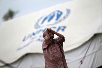 A girl from the Pauktaw township stands in front of her family’s shelter in a Rohingya internally displaced persons (IDP) camp outside Sittwe. – Photo: Soe Zeya Tun, Reuters