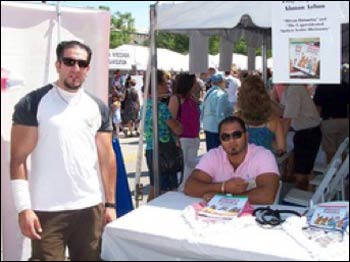Ahmad (l.) and Tony selling their book at an Amman open-air market.