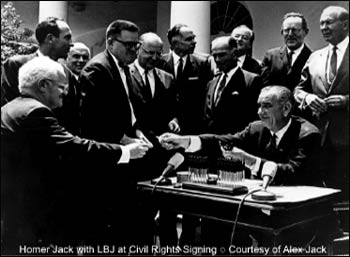 Homer Jack with President Lyndon Johnson signing civil rights legislation. – Photo: UUA, Courtesy of Alex Jack