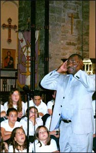 Imam Bilal Muhammed offering the Adhan, the Muslm call to prayer, at an interfaith service in Kansas City.