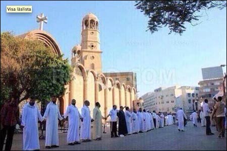 This photo of Muslim men protecting a Catholic Church in Egypt during mass was Tweeted by James Martin, SJ. He gave the photocredit to Will McHoebag, who doesn’t know where it came from. That ambiguity adds an appropriate layer of confusion to the news coming from Egypt – good and bad – about religious minorities. See the first two stories below.