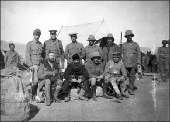 Younghusband (seated in the middle, with the fur coat and hat) travelling in China for the British government in 1904. Photo: Wikipedia
