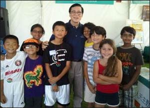 Mayor Sukyee Kang of Irvine, California, with First Drops performers at the Irvine Global Festival Village.