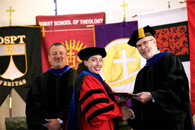 GTU Commencement Ceremony on May 7, 2015 held at Pacific Lutheran Theological Seminary. Pictured from the left are: Hal Leach, Chair of the Board of Trustees; Ashley Bacchi, Ph.D. student and winner of the Outstanding Dissertation Proposal in 2014; Riess Potterveld, GTU President.
