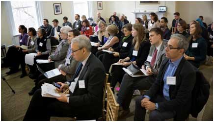 Tim Phillips (foreground left) of Beyond Conflict and Jeremy Ginges (foreground right), from New School for Social Research, listen to presenters. – Photo: El-Hibri Foundation
