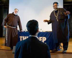 Father Steven Pavignano (l.) and Imam Talib Abdur-Rashid address a student during an interfaith dialogue at Seton Hall Preparatory School. – Photo: Interfaith Center of New York