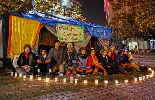 The Oakland Interfaith Coalition the night the police raided the park, but allowed the interfaith community to stay. See the Report from Berkeley below for details.