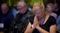 Attendees pray during The Family Research Council’s Values Voter Summit on Sept. 14 in Washington, D.C