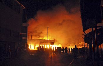A mosque being burned in northern Myanmar – Photo: AP Photo/Daily Eleven Media