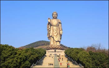 Tourists visit the popular Lingshan Grand Buddha at Wuxi, Jiangsu province, which stands 88 metres high. – Photo: Shutterstock