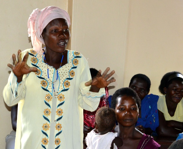 Woman sharing her experience about her marriage and property issues in her home and her community in general, in Bufuula, a village, Jinja district – Photo: URI Great Lakes Region, Facebook