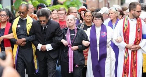 Clergy in Charlottesville counter the alt-right white supremensists. – Photo: CBS News Video