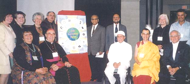 These 13 individuals represent the 13 traditions whose golden rule texts are used on the poster. Leslie Mezei is seated on the far right – Photo: Scarboro Missions