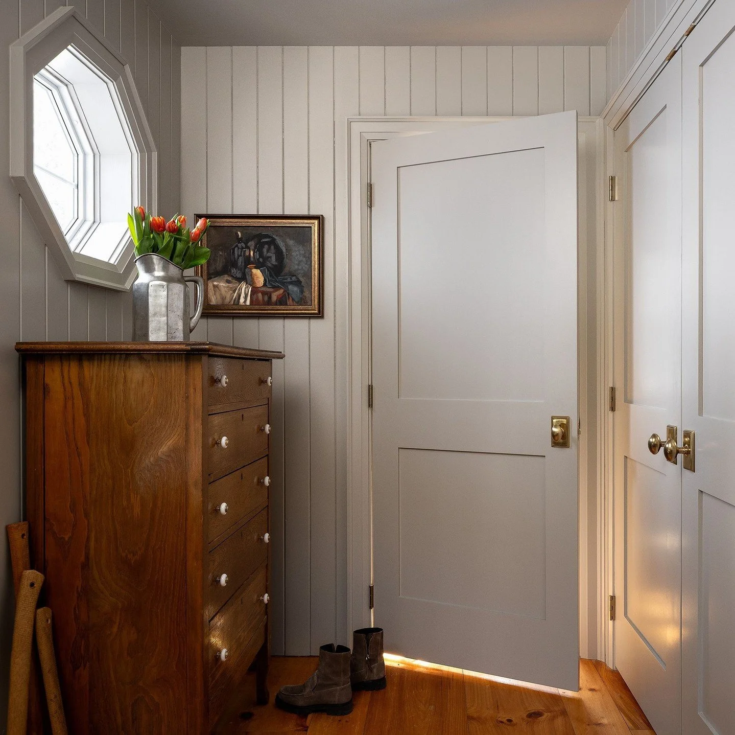 Farmhouse mudrooms are the workhorse of the home making room for seasonal gear, all manner of footwear, closed storage, pet belongings, and an axe or two.  Classic and softly colourful, this sweet mudroom does it all.  Hardworking doesn't mean it can