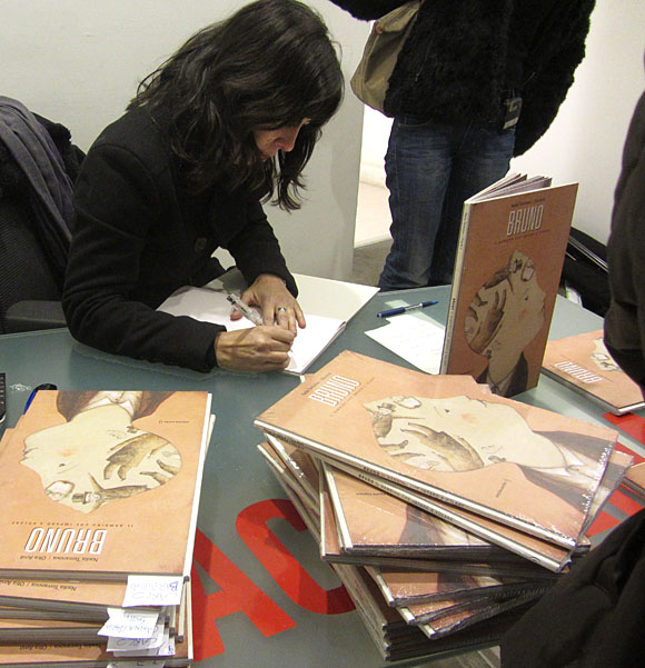 Signing books at the opening
