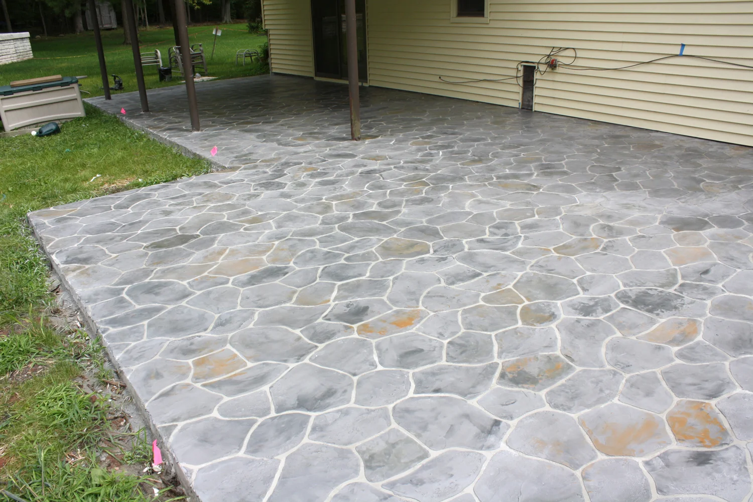 Triple 7 Bondcoat, SM Pro Natural as base coat, bushrock stencil, SM Pro white powder, MT 3000 liquid polymer, MTC liquid colors; Med gray, Dk gray, Sun Baked Clay, Slate green. 2 coats of poly seal 400