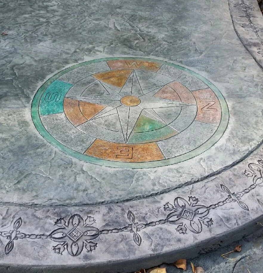 This patio used the Roman Slate Seamless stamp pattern with a decorative border and the Compass medallion. Primary colors used were Light Gray highlighted by the Antique process.
