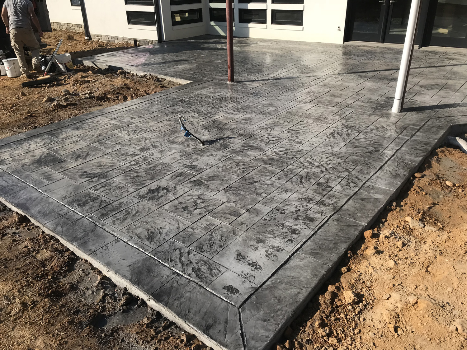 Stone gray color hardner and medium gray release stamped with royal Ashler slate pattern.