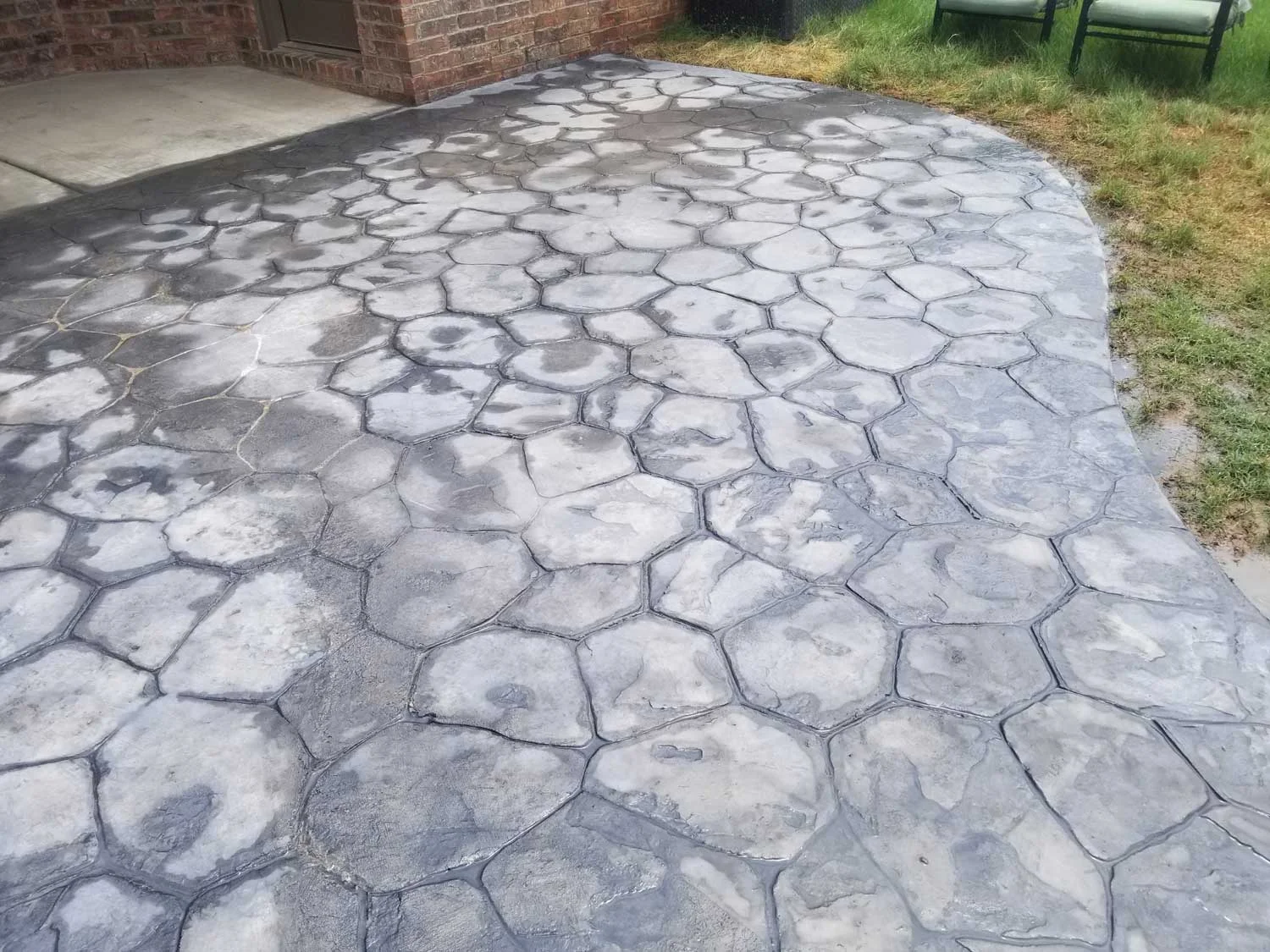 We made sidewalk that came from the back entrance of the customers house that led to a shed. Random Stone stamps were used along with Storm Grey powdered Integral & Stone Gray Antique Release. on the picture we had not done the seal, but once we power washed some of the powder off we sealed it a clear coat.