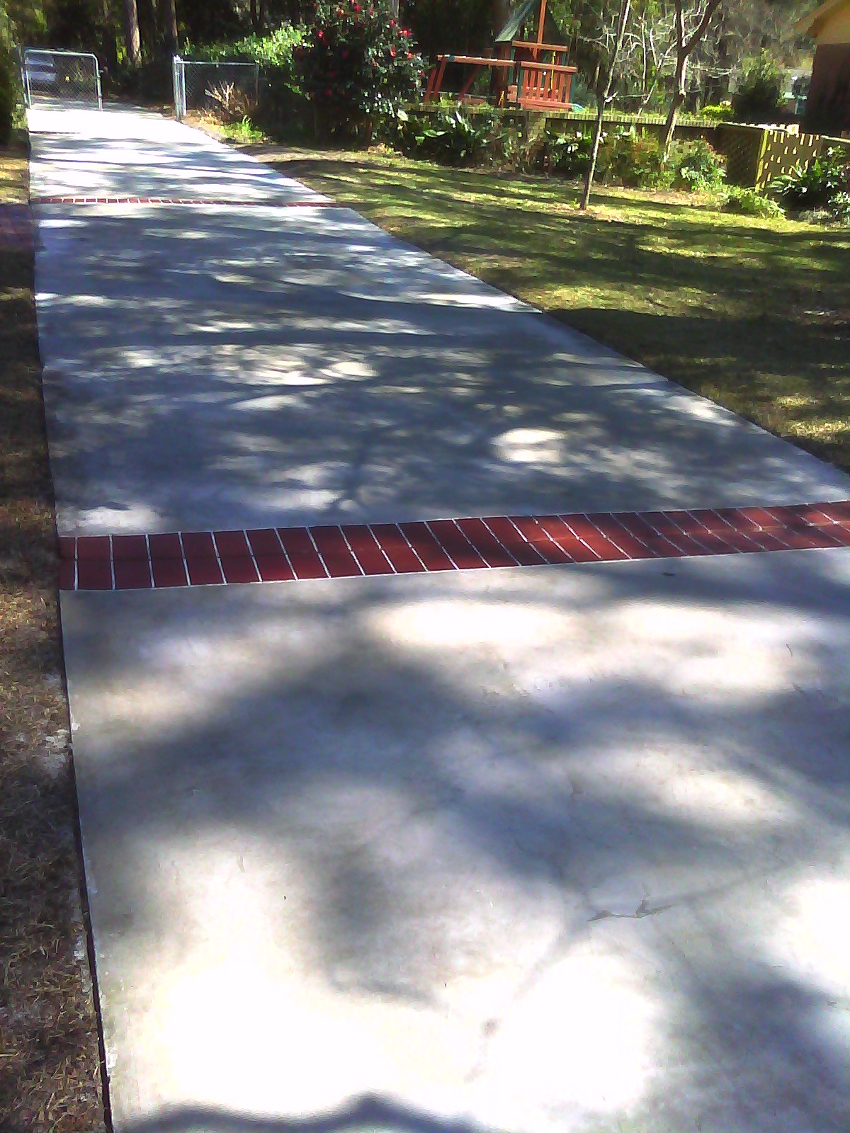 Complete driveway overlay with brick hand stained
