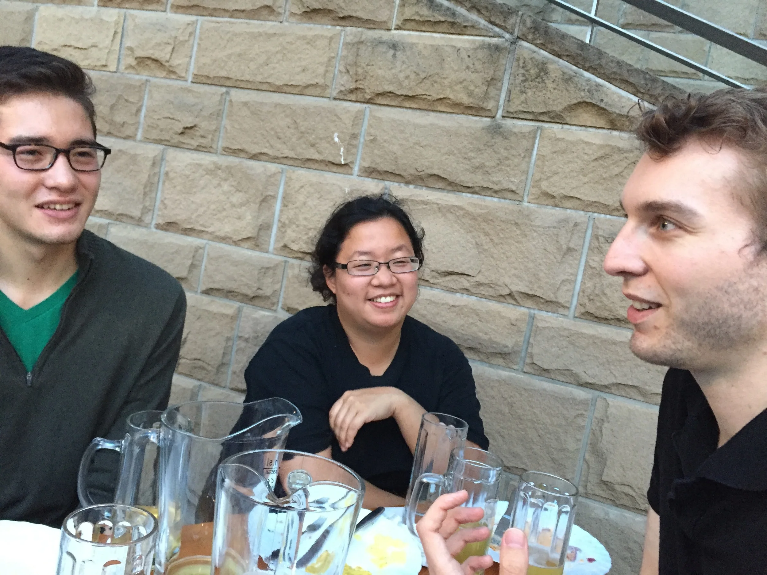 Noel, Jennifer, and Andrew enjoying German food at the Beer Garden along waterside.