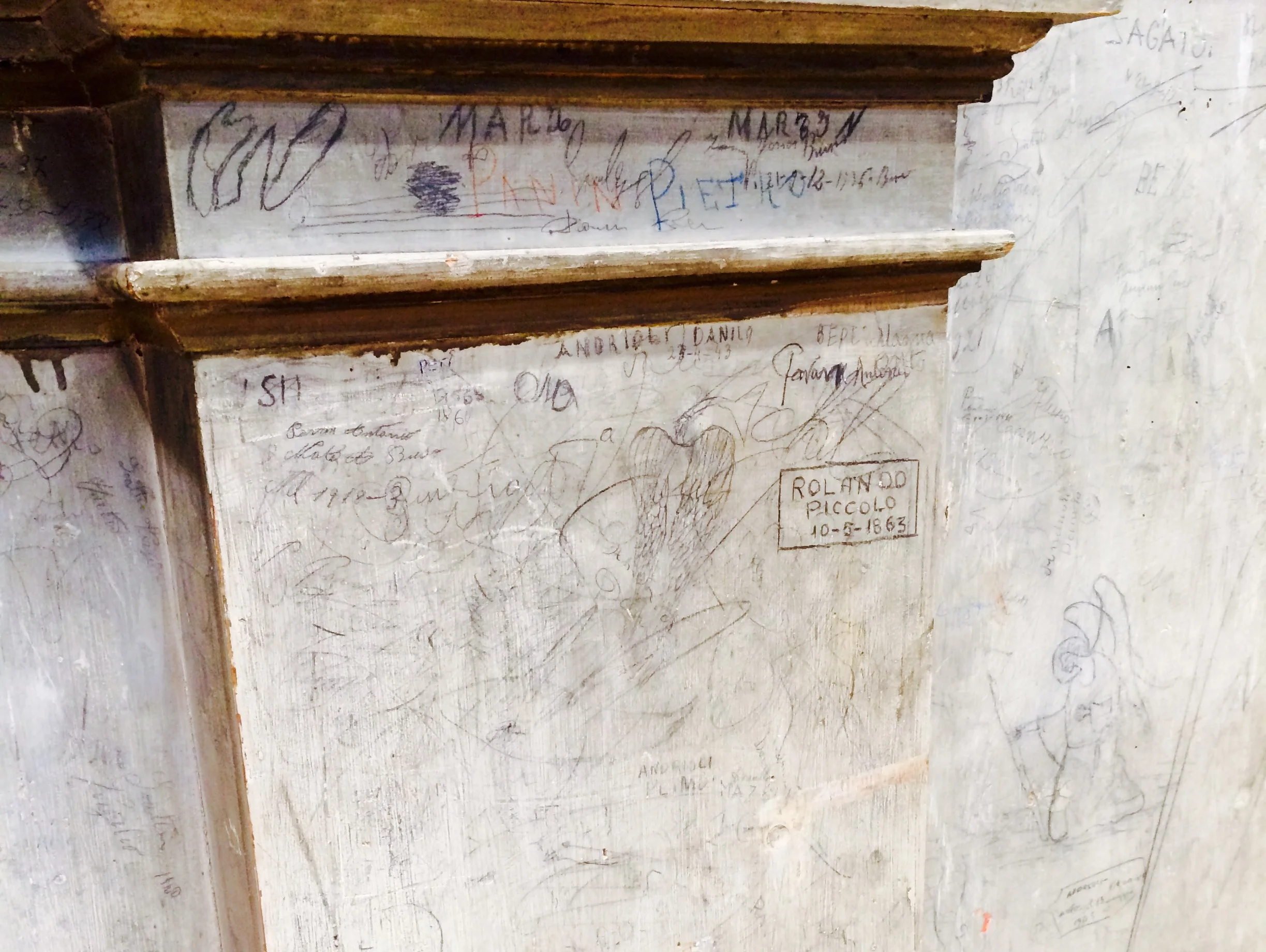 Centuries-old graffiti adorns the case of the historic Italian organ