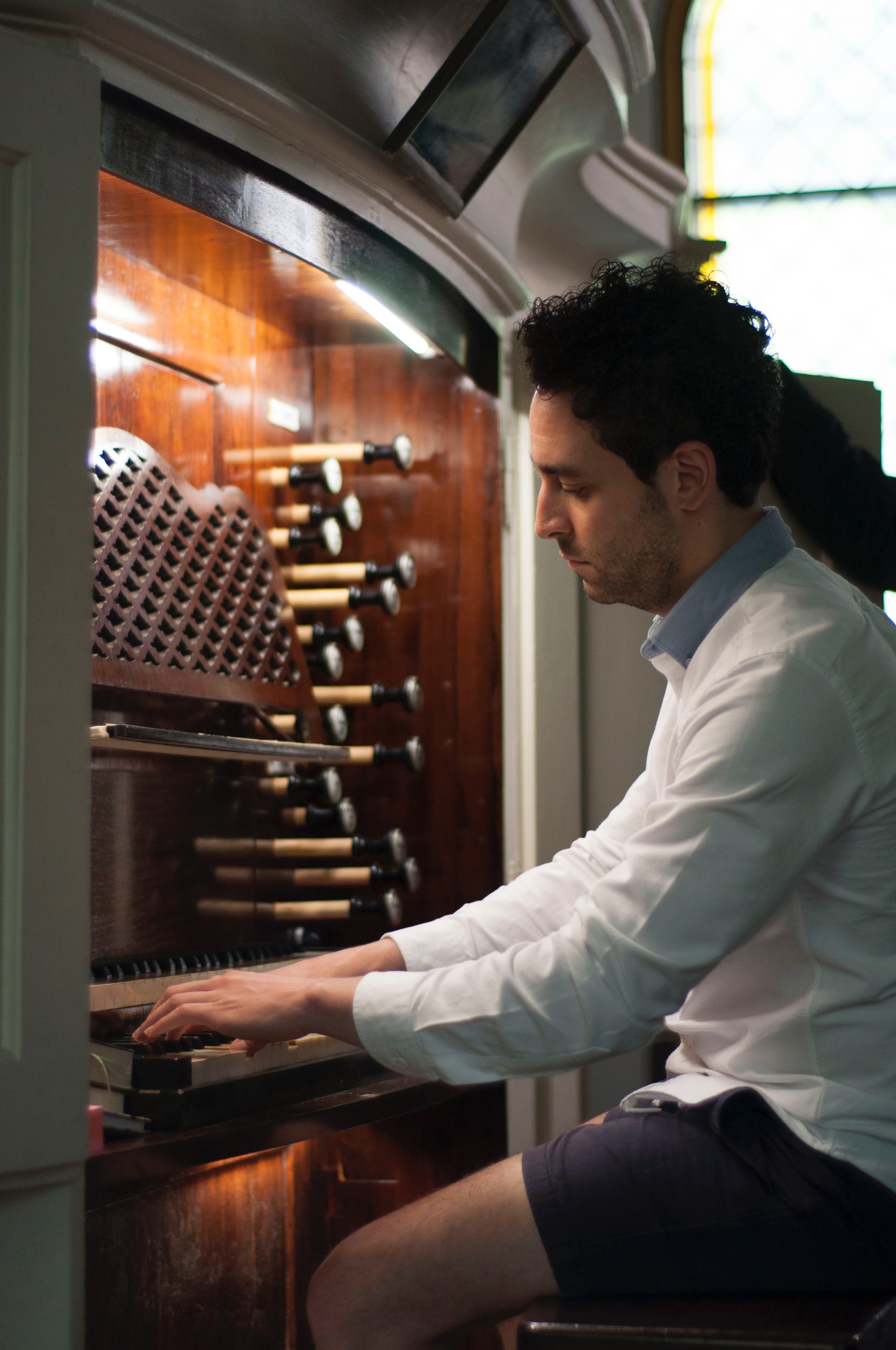 Gianmarco tries his hand at the Mendelssohn Organ's action.