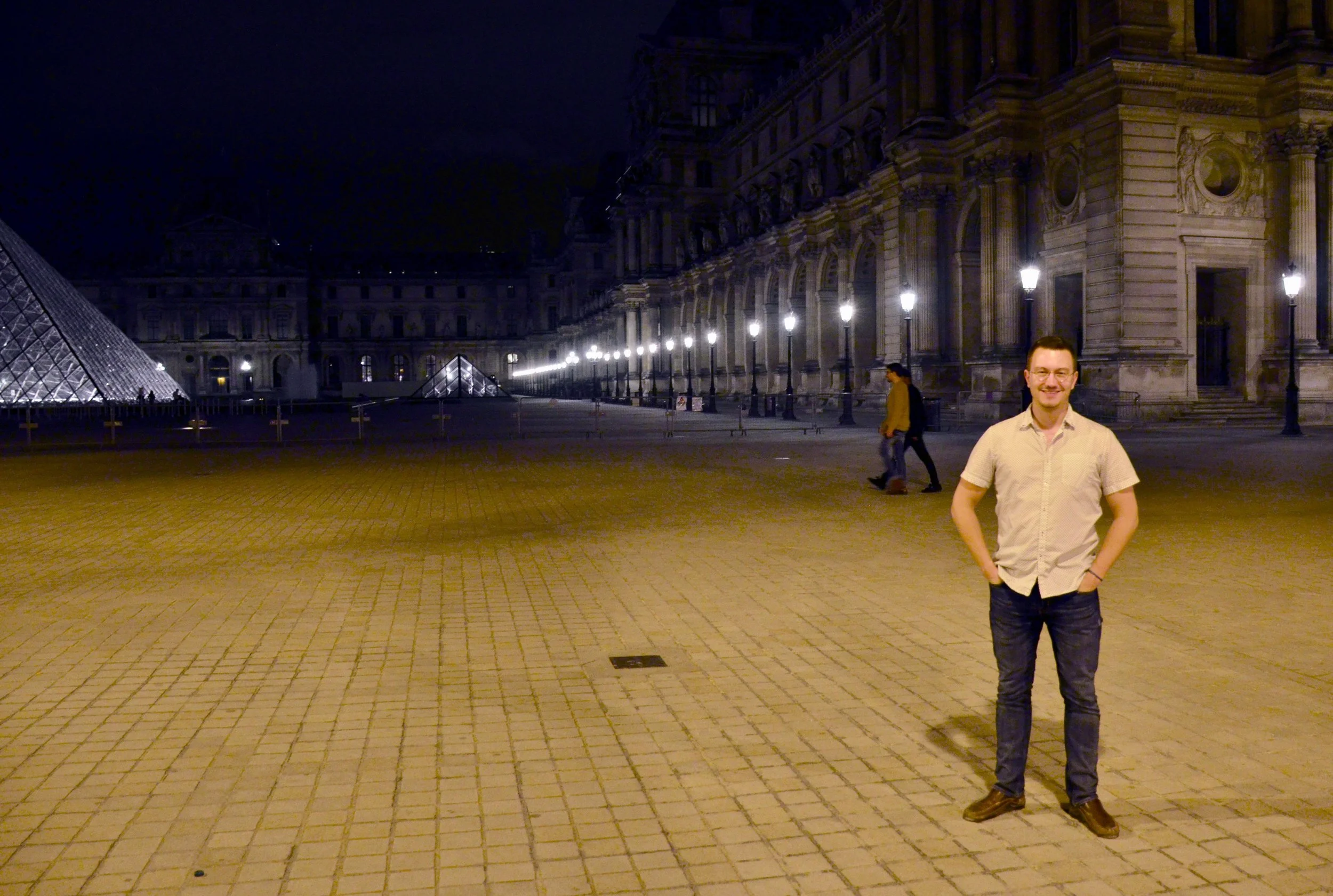 Corey de Tar in front of the Louvre