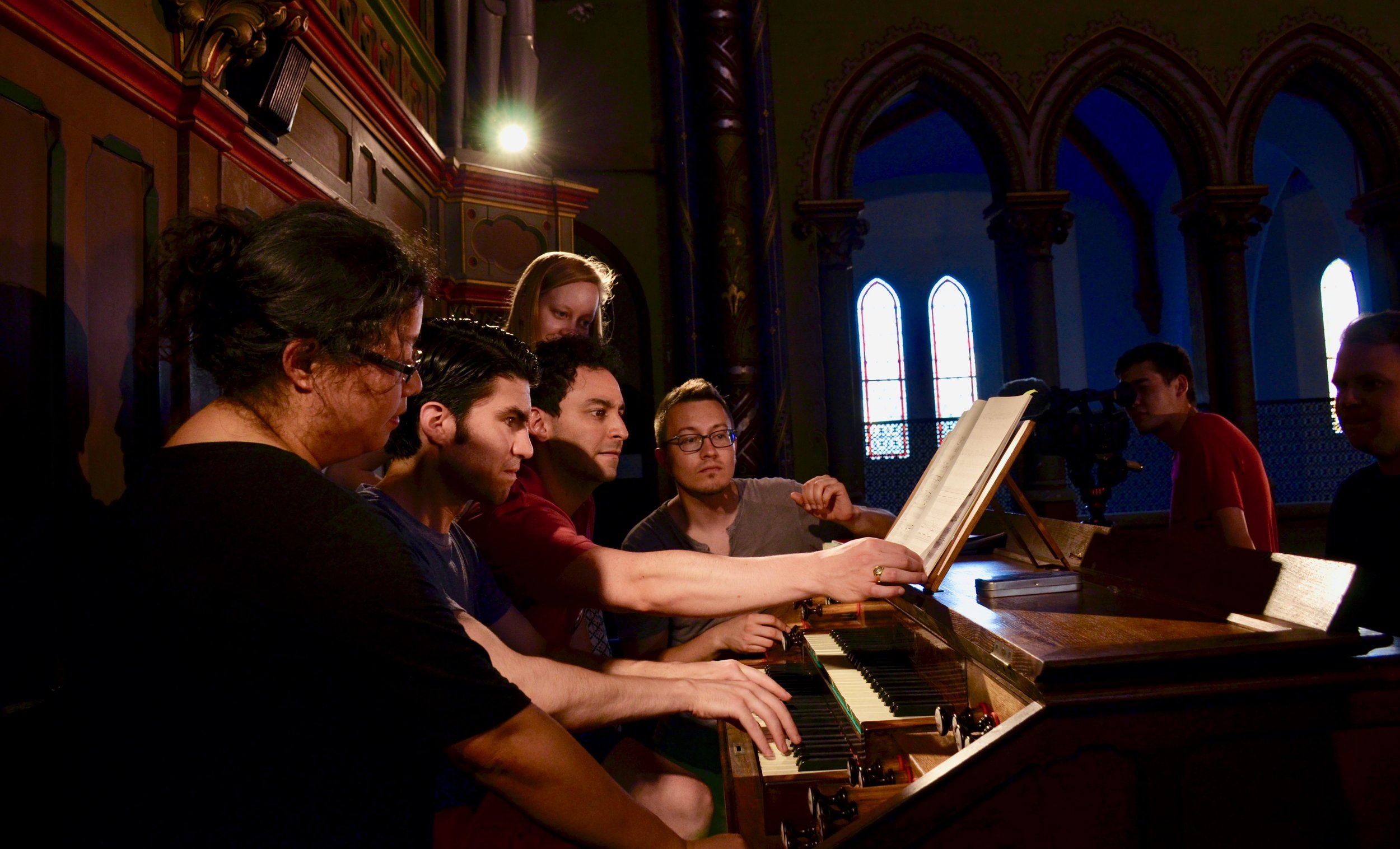 Members of Boston Organ Studio try out the organ in Gésu Church