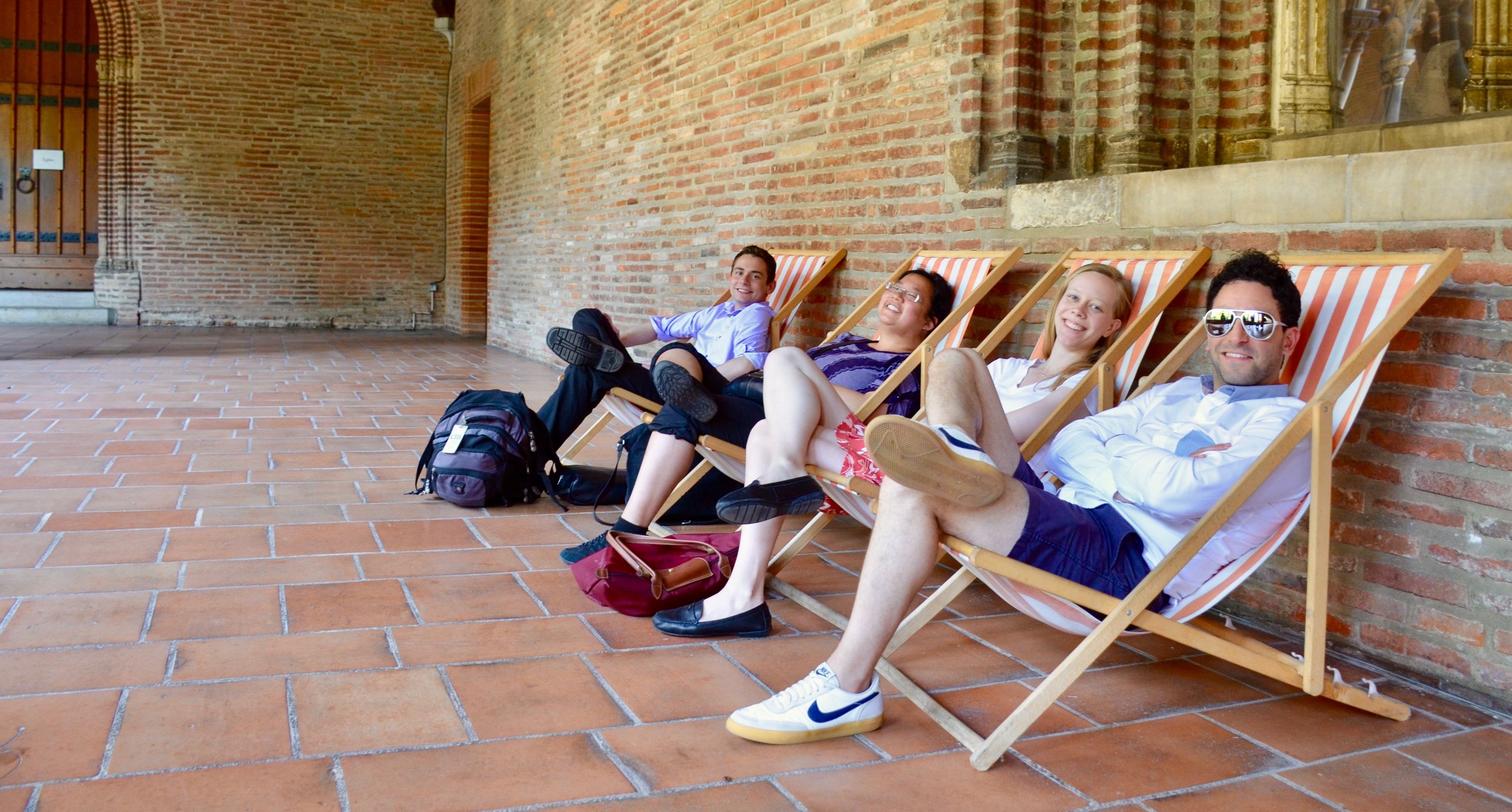 Gianmarco Massameno, Laura Gullett, Noel de Sa e Silva, and David von Behren relaxing in the cloister of Musee des Augustins, Toulouse.