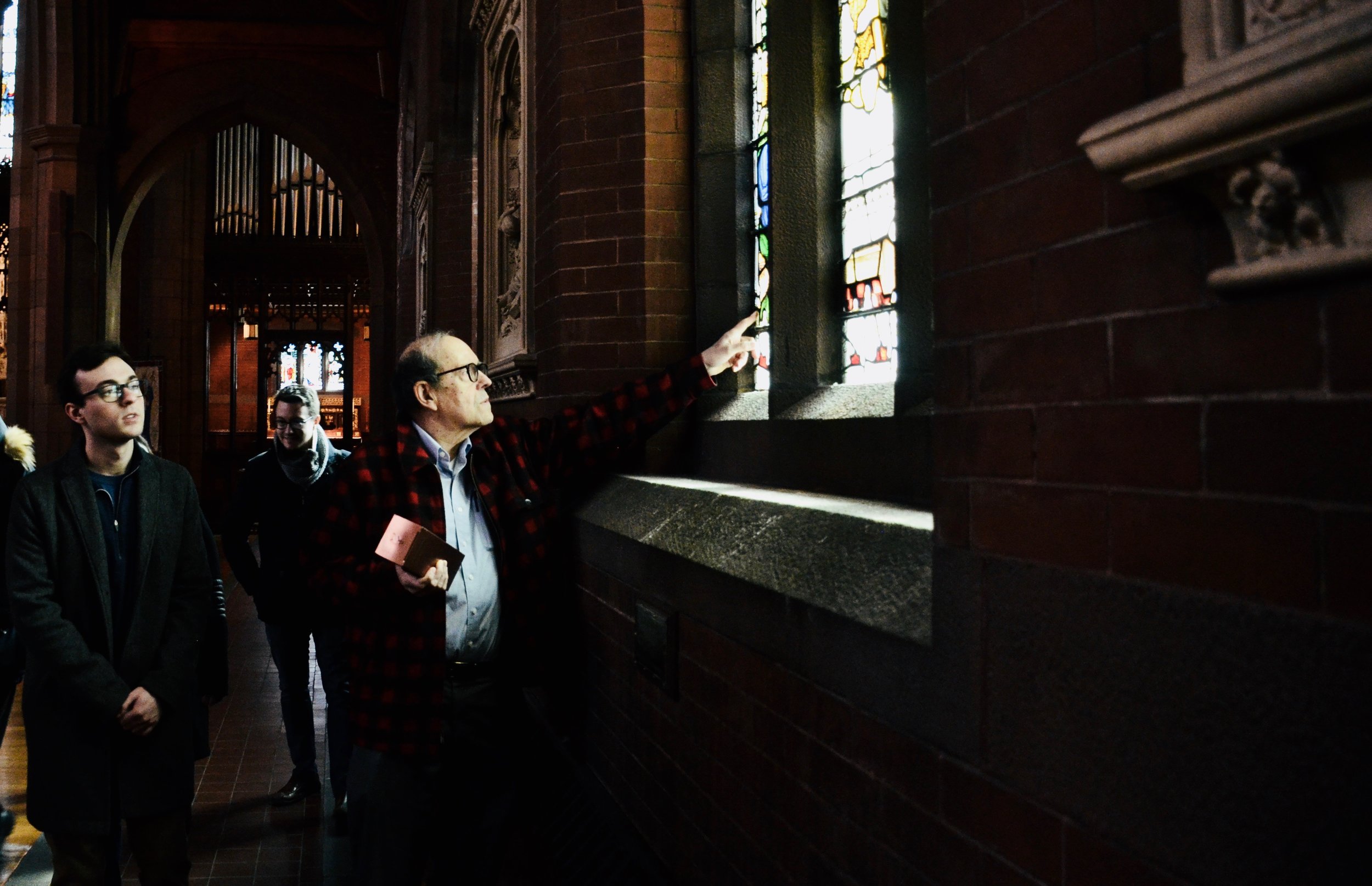 Professor Thomas Murray points out details in the stained glass as we depart Christ Church