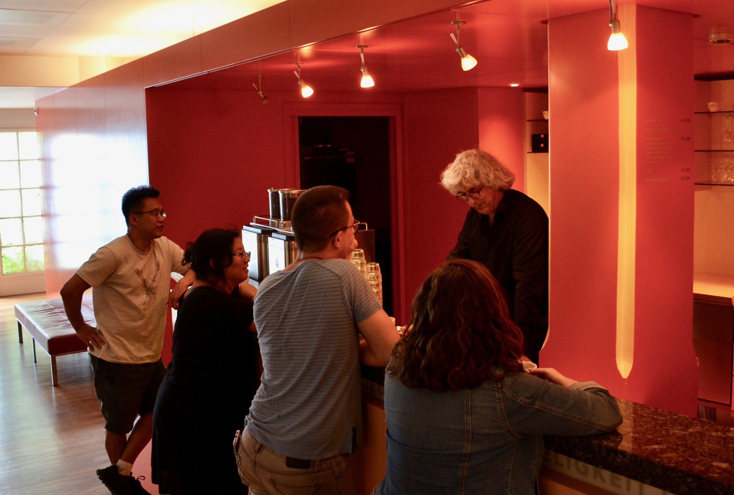 Hans Fidom of Orgelpark generously pours coffee for the group.