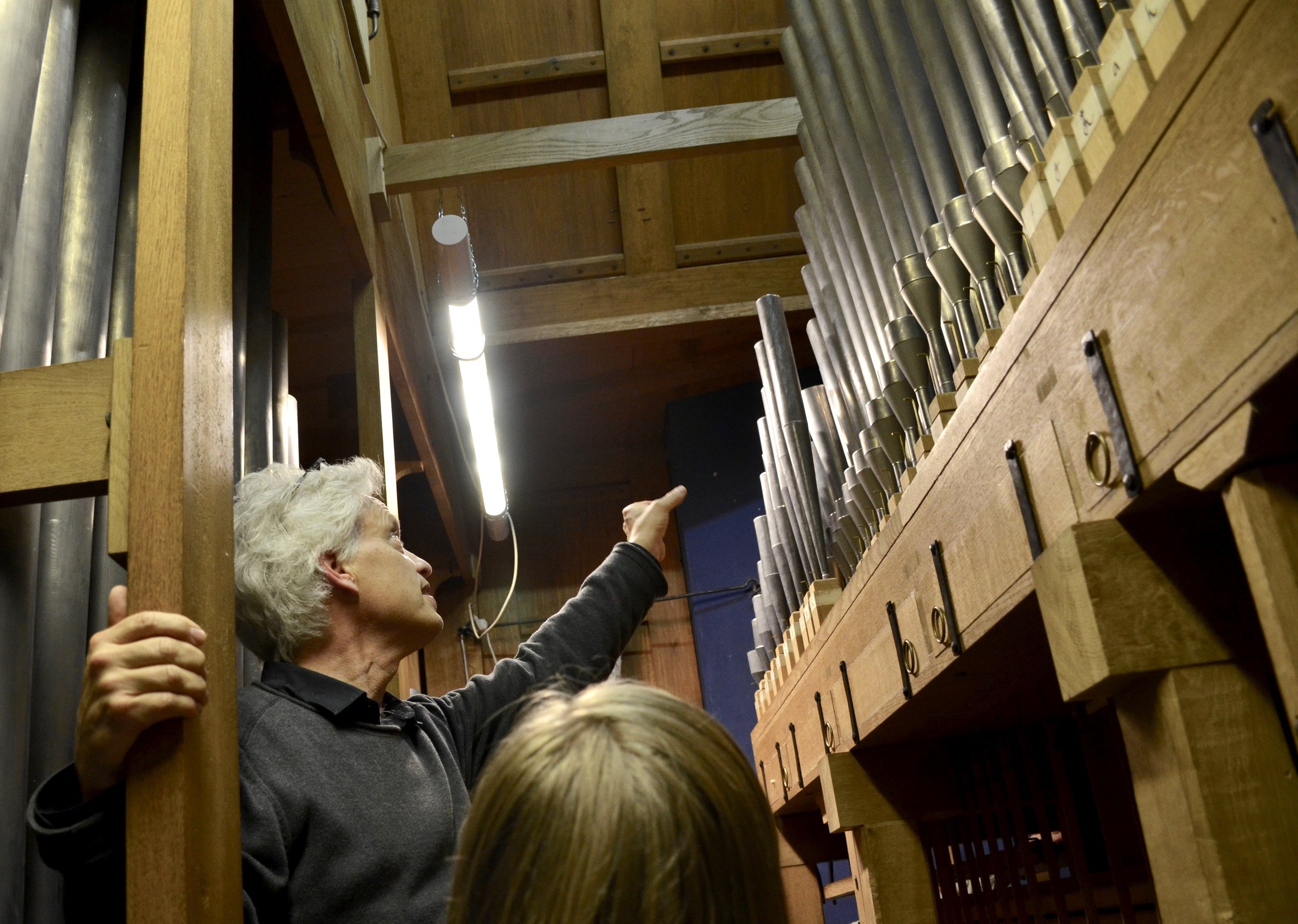  Hans Davidsson points out intricacies of the pipework and mechanism of the 2000 GoART North German Baroque Research Organ in Örgryte New Church, Göteborg, Sweden. 