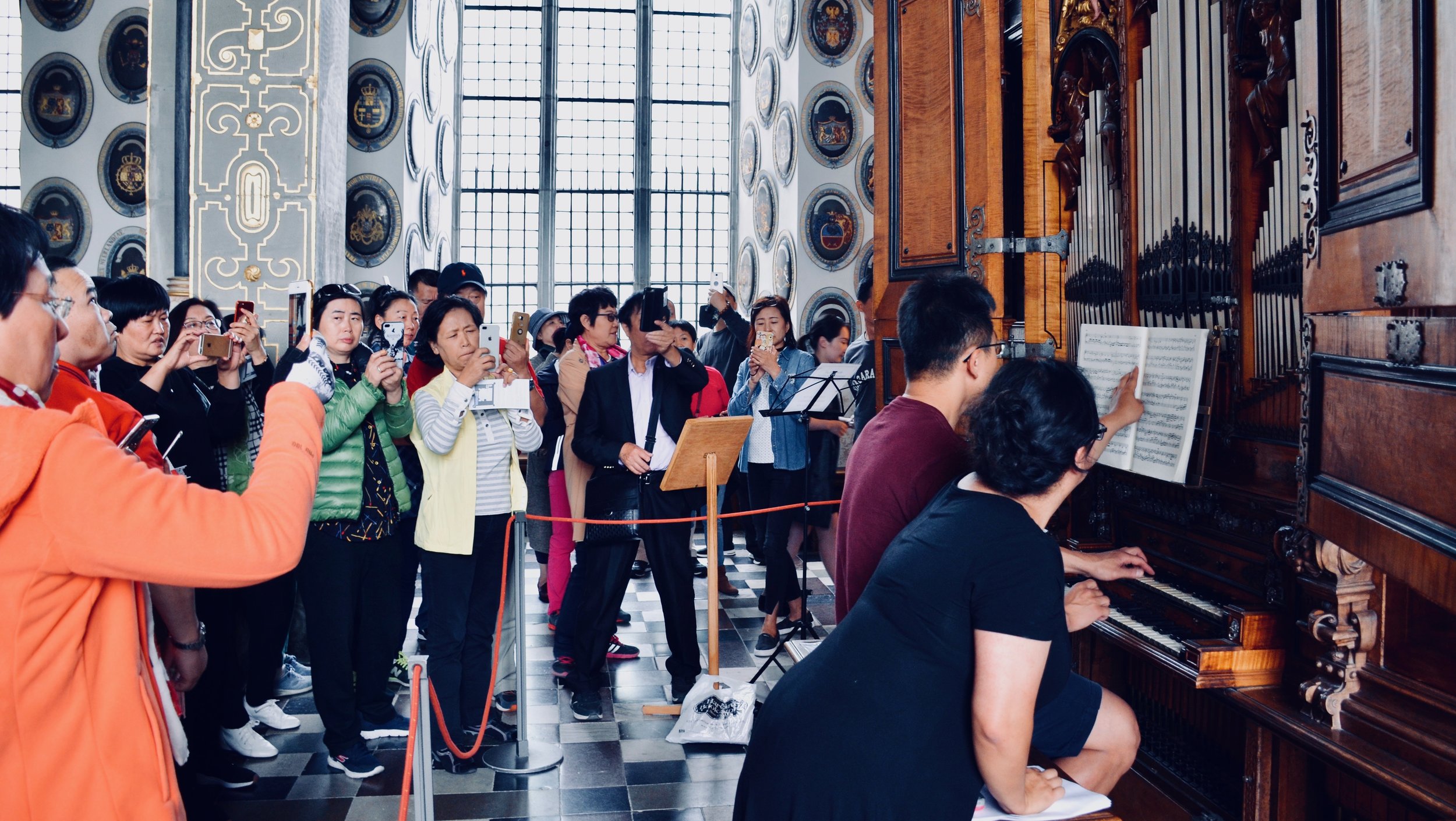 Adrian Cho is a YouTube star, as a sea of tourists record his performance of Sweelinck. 1610 Compenius organ, Frederiksborg Castle, Hillerød, Denmark.