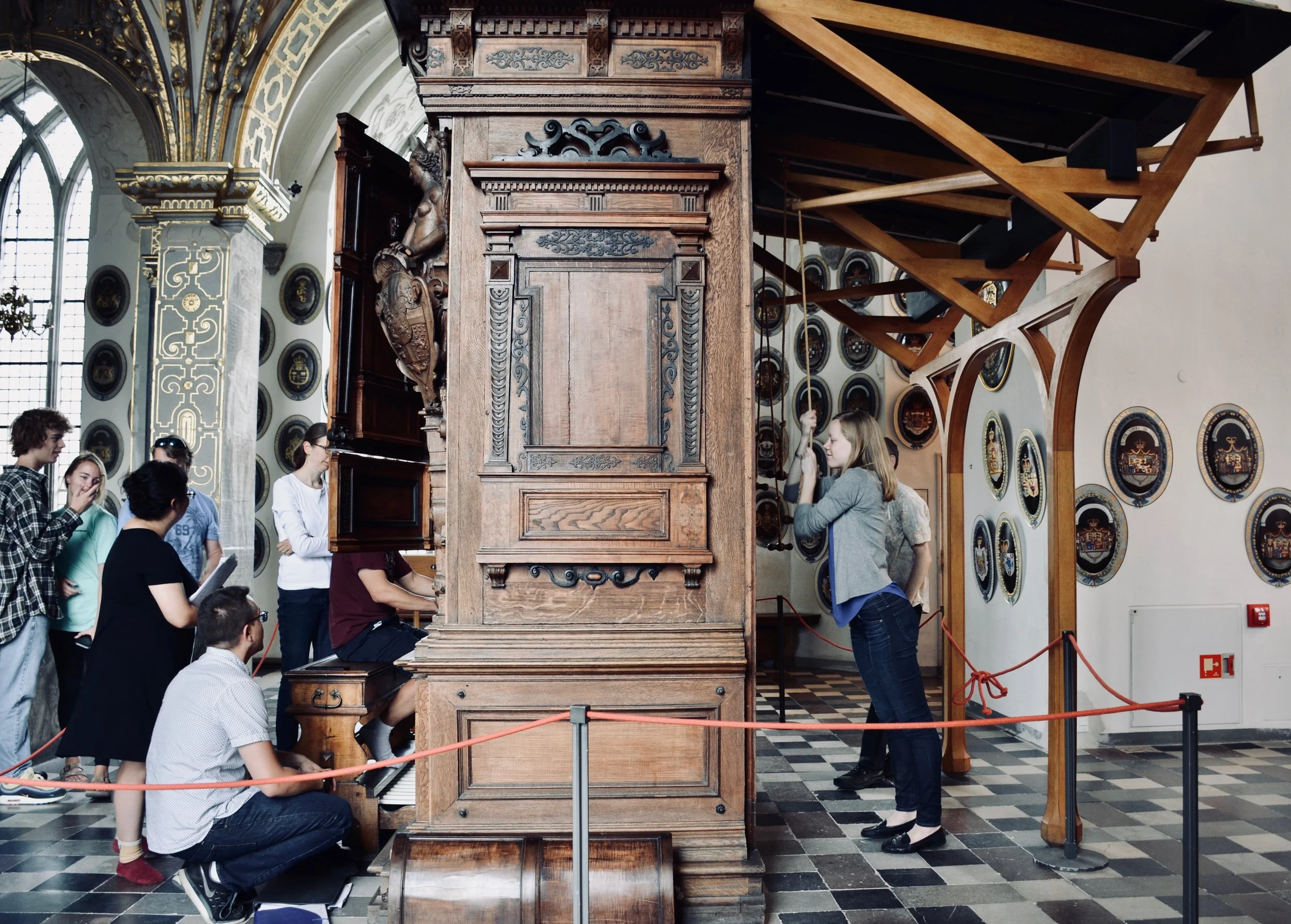 Pumping the bellows, Castle organist Bine Bryndorf coaches Adrian Cho, 1610 Compenius organ, Frederiksborg Castle, Hillerød, Denmark.