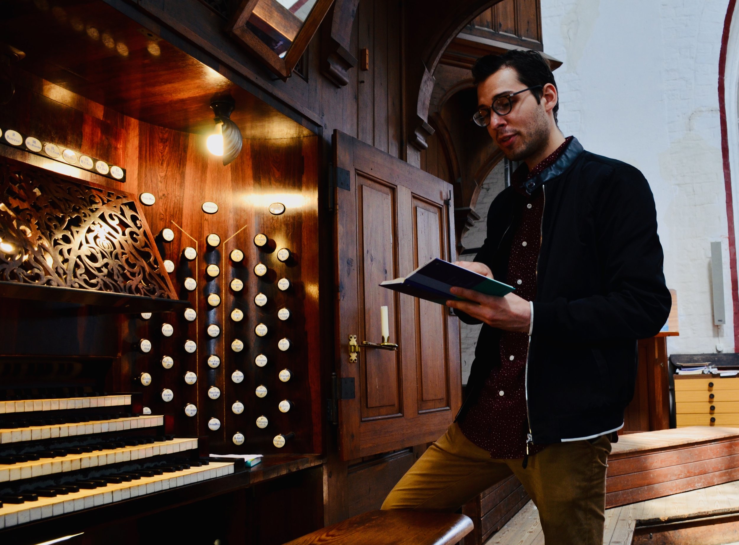 Nick Capozzoli examines the hymnal of 1871 Schwerin Dom.