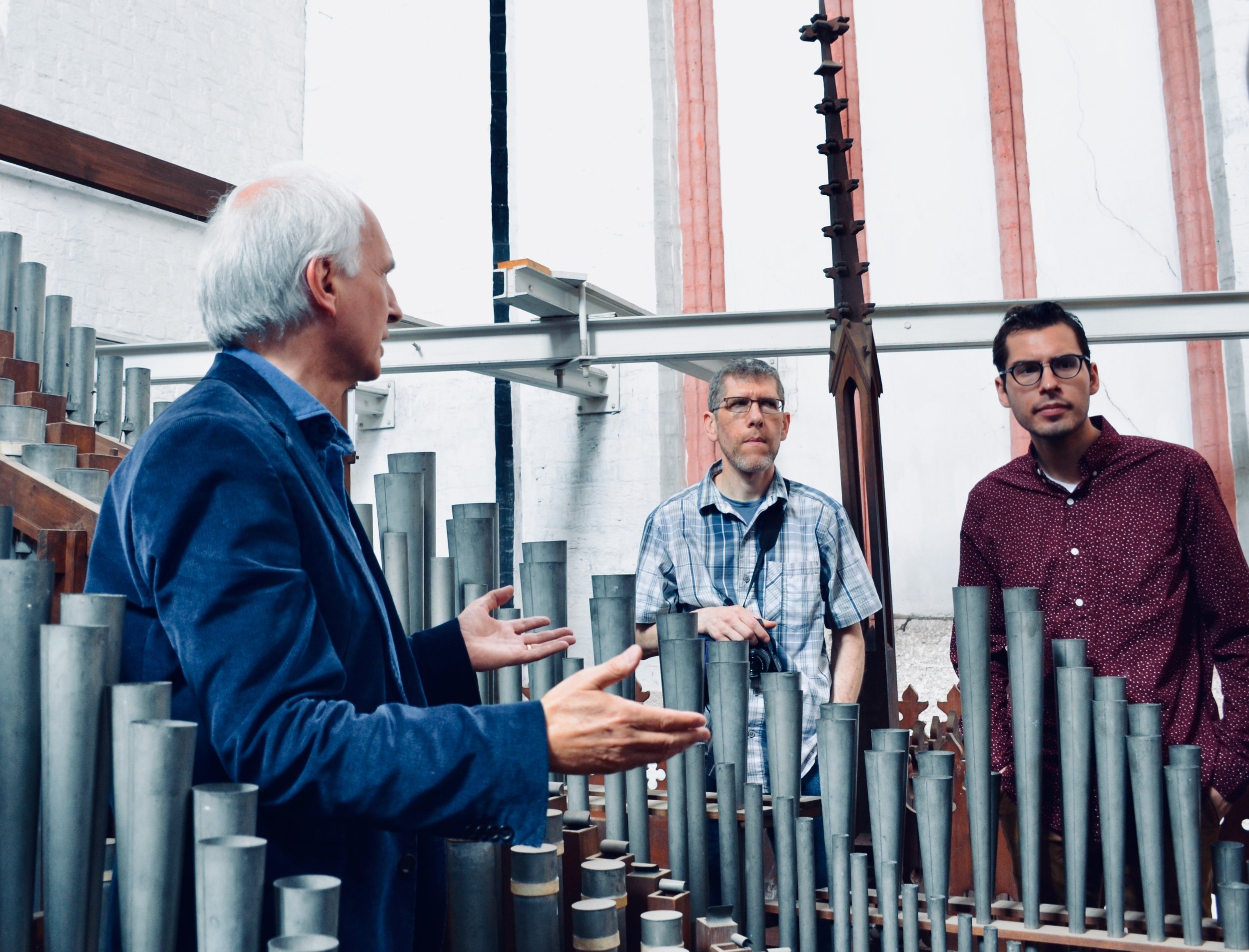 Prof Jan Ernst points out features of the pipework. 1871 Ladegast Organ, Schwerin Dom. Boston Organ Studio.