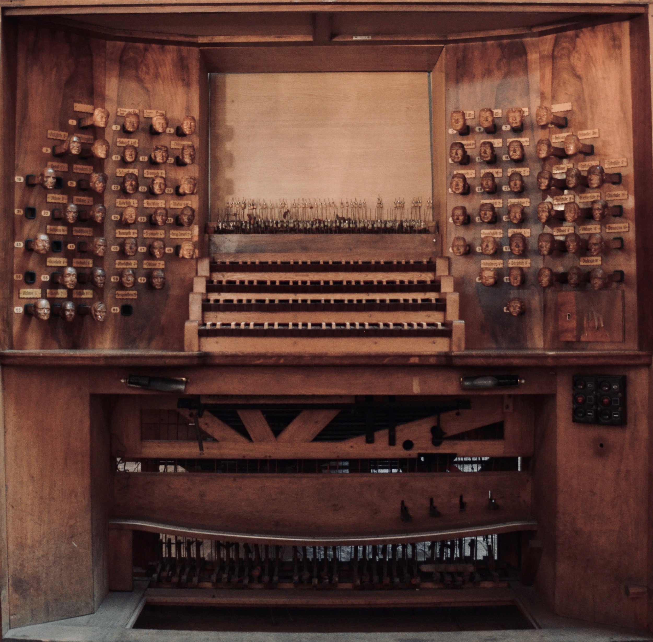 The old organ console of St. Jacobi, Hamburg, features the faces of financial donors carved as stop knobs.