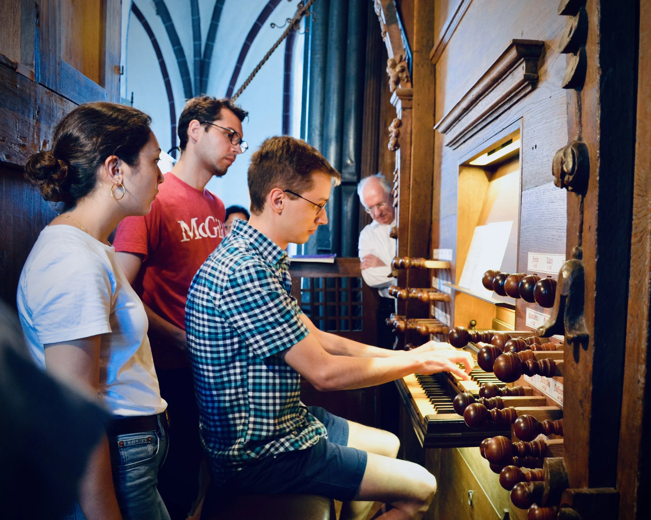 Alex Ross plays the 1624 Scherer organ in Tangermünde, as organist Christoph Lehmann looks on.