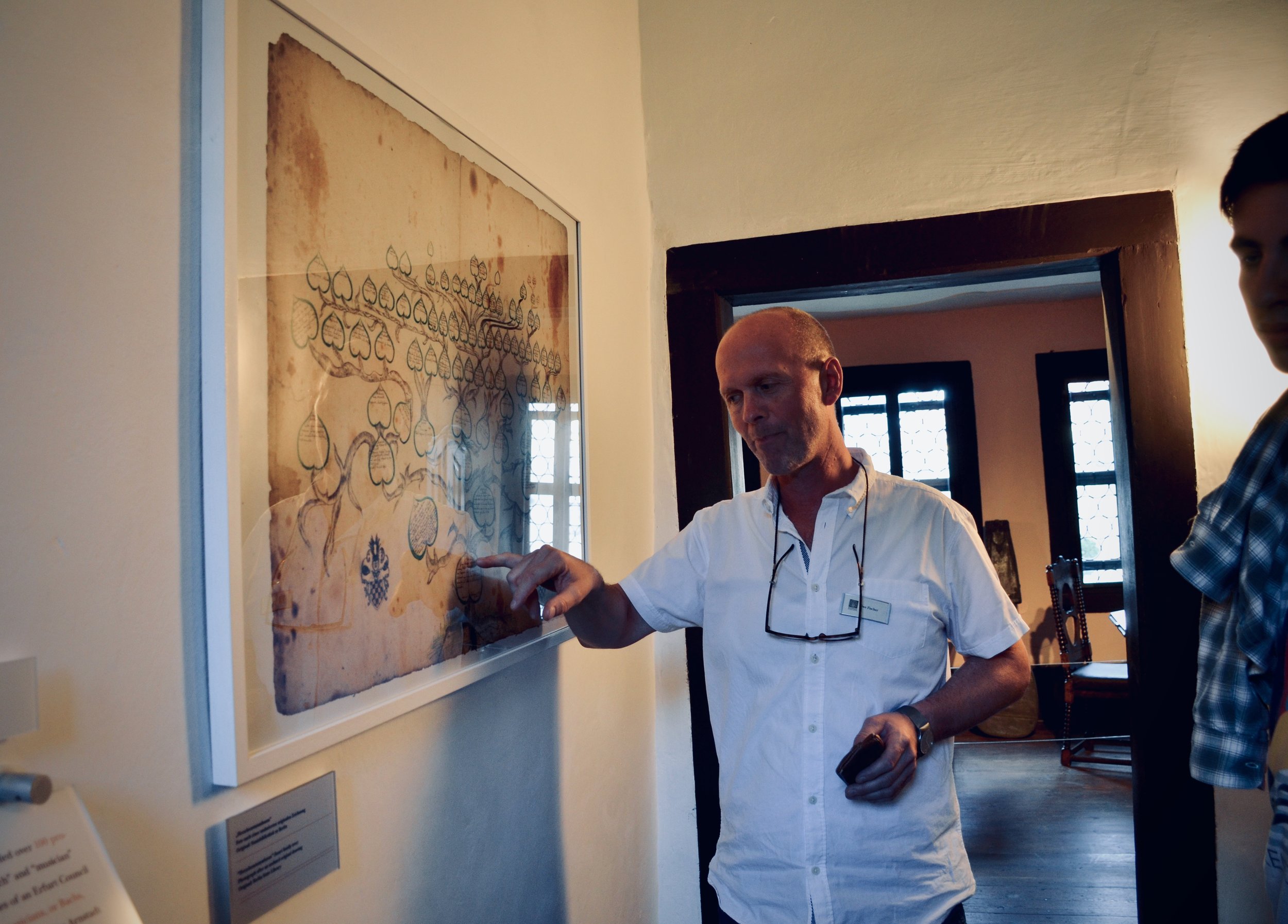 Curator Uwe Fischer shows the Bach family tree, Bachhaus Museum, Eisenach.