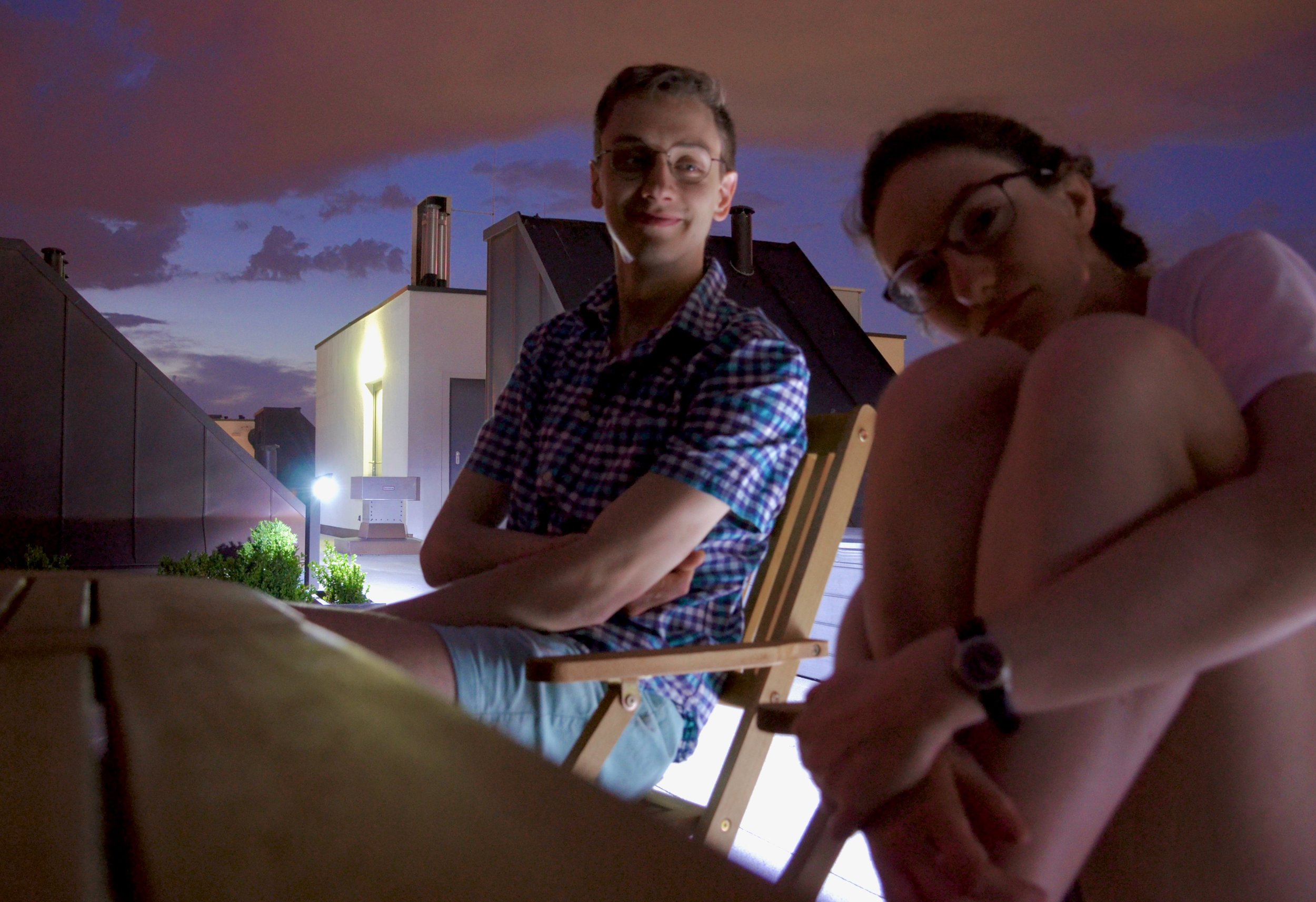 Alex and Rosemarie enjoy dinner on the roof deck.